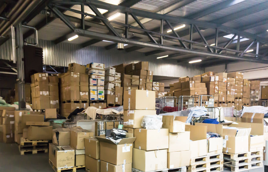 Disorganized warehouses with boxes spread everywhere